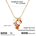 Macro detail of Santa Claus pendant necklace in stainless steel with pearl and crystals - Santa Claus (DKN254099-3GL)