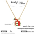 Detail shot of golden stainless steel Christmas necklace with red gift box pendant details - Red Gift Box with Green Ribbon (DKN254099-4GL)