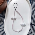Detail of beaded phone wrist strap featuring lavender beads and white cloud charms - Lavender