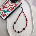 Macro shot of red crystal beads and iridescent pearls on a phone wrist strap - Red White Iridescent Beaded Style (SJ-A240001B)
