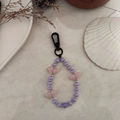 Close-up of heart-shaped beads and striped purple pearls on a stylish keychain - Purple and White Heart Beaded Style (YS-A230012I)