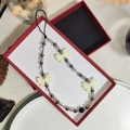 Handmade beaded phone strap with acrylic bow and silver beads in a premium gift box - Sz-a240007b