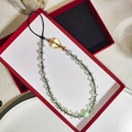 Handmade beaded phone charm with green stars, golden heart, and metallic beads in a gift box - Sz-a240009b