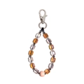 Detailed macro view of faceted crystal beads with a pink frosted bead on a silver lobster clasp - Light Purple Amber Faceted Beads Style (YS-A240013A)