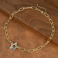Detailed close-up of a golden paperclip chain necklace with a colorful zircon star pendant - Rainbow Star Style (NE2598-D)