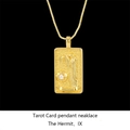 Detailed close-up of golden The Hermit Tarot card pendant with a sparkling diamond stone - The Hermit / Gold
