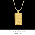 Macro detail of golden Justice tarot pendant necklace with sparkling inset crystal stone - Justice / Gold