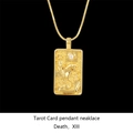 Macro view of gold tarot Death card pendant with inlaid diamond and box chain - Grim Reaper / Gold
