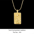 Detailed close-up of golden The Star tarot necklace with a sparkling white zircon stone - Star / Gold