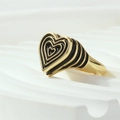 Macro side view of layered heart ring with black enamel inlay and gold plated finish - Adjustable Open / Black
