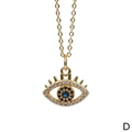 Detail shot of golden Evil Eye pendant with blue stone and zircon inlay on a delicate chain - Double Rhinestone Circle Black Pupil Style (NE1454-D)