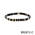 Detail view of Bohemian Tila bead bracelet with black enamel, blue spotted beads and gold spacers - Black Glaze Blue Spotted Style (BR0872-C)