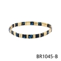 Detail of bohemian stretch bracelet with 18K gold metal beads and blue yellow enamel tiles - Black Gold Blue Yellow Splatter Style (BR1045-B)