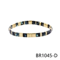 Detail of Bohemian stretch bracelet with gold cubes and black enamel splatter painted beads - Black Gold Blue Yellow Texture Style (BR1045-D)