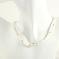 Detail of beaded necklace with white pearls, gold accents and a blue evil eye bead - White Shell / White Shell Style (NE1871)