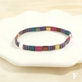 Detailed macro view of colorful enamel Tila beads on a stretch bracelet with metallic finish - Purple Rose Gold Silver Peacock Blue Mix (BR1688-F)