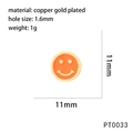 Macro detail of copper gold plated orange enamel smiley face charm with 1.6mm hole - Orange Style (PT0033)