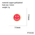 Detail of a 11mm gold-plated copper smiley face charm with red oil drip for jewelry making - Red Style (PT0038)