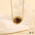 Detailed shot of evil eye pendant with sunburst frame and zircon inlays on gold chain - Realistic Brown Eye Sunflower Style (NE2265-B-3)