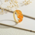 Detail of a golden open ring featuring an orange enamel monstera leaf design - Adjustable Open / Orange Style (RG0721-E)