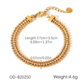Detailed macro view of triple-layered golden beaded bracelet with white zircon and lobster clasp - Three Layer Beaded Style (OD-B20250)