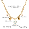 Detail of blue and white porcelain heart pendant on golden stainless steel necklace - Gold Heart Ceramic Bead Style (OD-N40570)