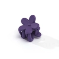Detail view of small matte purple flower hair claw clip with functional spring design - Deep purple