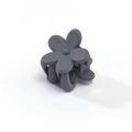 Detailed view of small dark grey matte flower hair claw clip for girls' hairstyles - Gray