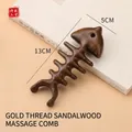 Fishbone-shaped sandalwood massage comb with natural wood grain and smooth polished finish - Golden Sandalwood Fish Bone Shape