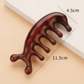 Deep reddish-brown sandalwood five-tooth massage comb measuring 11.5cm by 4.5cm - Red Sandalwood Polished Dolphin