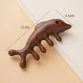 Deep brown dolphin-shaped sandalwood scalp massage comb with five teeth, size 11x4.5cm - Golden Sandalwood Four Tooth Whale
