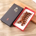 Handcrafted sandalwood massage comb with natural grain in an elegant black gift box - Golden Sandalwood Ten Tooth Snail In Gift Box