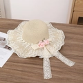 Straw sun hat in natural beige featuring white lace brim and pink satin floral accents - Two Pink Flowers Beige