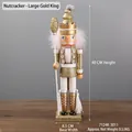 40cm gold Nutcracker king figurine with sparkling glitter and white feather details - Nutcracker - Large Gold King