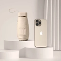 Compact ultra-light champagne gold folding umbrella shown beside a smartphone - Flat 6-Fold Ordinary Black Glue / With Cloth Sleeve / Sycamore Beige