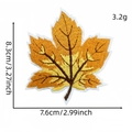 Embroidered maple leaf patch with 8.3cm height and 7.6cm width measurements - Tan