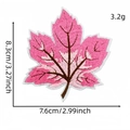 Detailed view of a pink maple leaf embroidered patch with precise size and weight measurements. - Pink