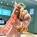 Cherry blossom liquid keychain with floating animal and red silicone bubble wrist strap - Red Strap - Cartoon Animal Cherry Blossom Shape