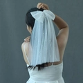 White bridal veil with double layers, a large bow, and delicate pearl embellishments - Short Beaded Veil