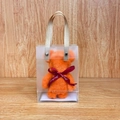 Orange coral fleece bear towel in a clear PVC gift bag with red ribbon decoration - Bear And Horse Orange + Pvc Handle / 30*30cm