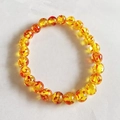 Single strand 8mm round yellow resin cat eye beads bracelet with red texture details - Orange Textured Style