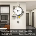 Modern black and white astronaut themed wall clock with hanging pendulum and small shelf - Large and Astronaut Ornament