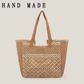 Handwoven straw tote bag with brown leather handles in beige and brown geometric pattern - Camel