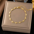 Elegant gold-plated stainless steel bracelet featuring delicate heart-shaped charms - Heart-Shaped Bracelet - Gold