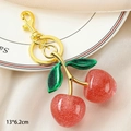 Sparkly red cherry keychain with green glitter leaves and golden clasp 13x6.2cm - Double Leaf Cherry - Glitter Red