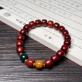 Sandalwood Buddhist prayer beads with three-color accent stones on a calligraphy book - Pterocarpus Tinctorius 8x9mm Three-Color Old Bead