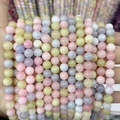 Detailed close-up of colorful 8mm macaron chalcedony round beads for DIY jewelry making - A28 Chalcedony - Morganite