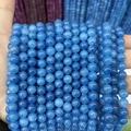 Close-up of polished blue chalcedony round beads with natural stone textures for jewelry - A478 Chalcedony - Crystal Apatite