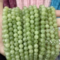 Close-up of polished light green chalcedony round beads for DIY jewelry making - A4 Chalcedony - Peridot Quartz