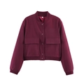 Detailed shot of burgundy bomber jacket featuring large pockets and snap button closure - Burgundy
